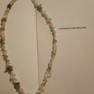 A handmade real crystal healing stone necklace mid length.